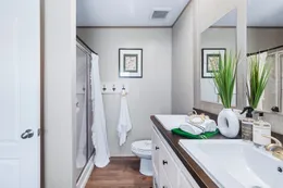 The ANNIVERSARY 16763I Primary Bathroom. This Manufactured Mobile Home features 3 bedrooms and 2 baths.