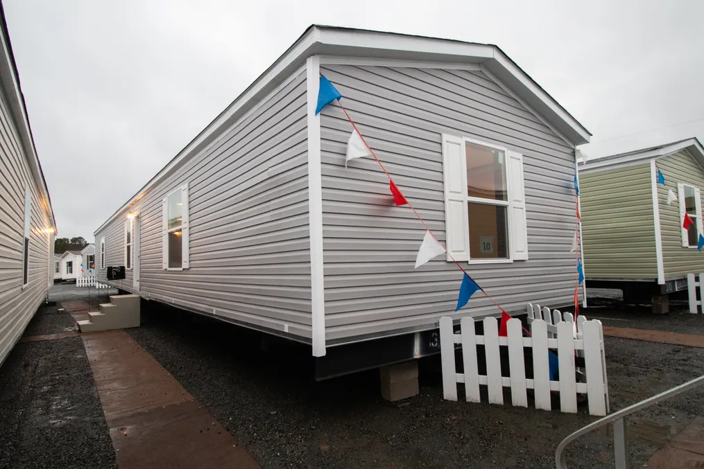 The COLOSSAL Exterior. This Manufactured Mobile Home features 3 bedrooms and 2 baths.