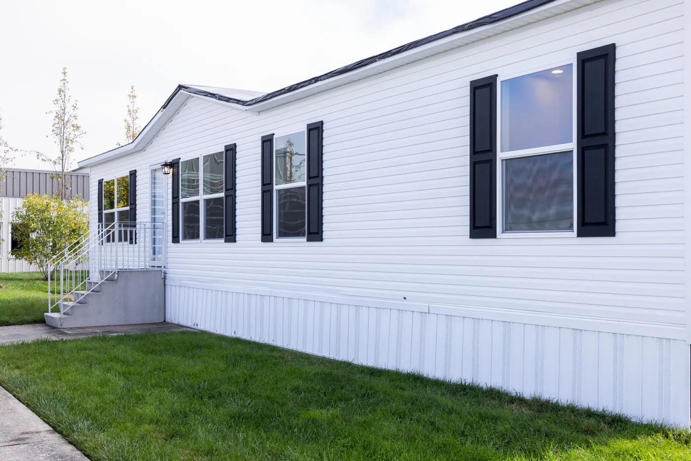 The PLATINUM ANNIVERSARY Exterior. This Manufactured Mobile Home features 3 bedrooms and 2 baths.