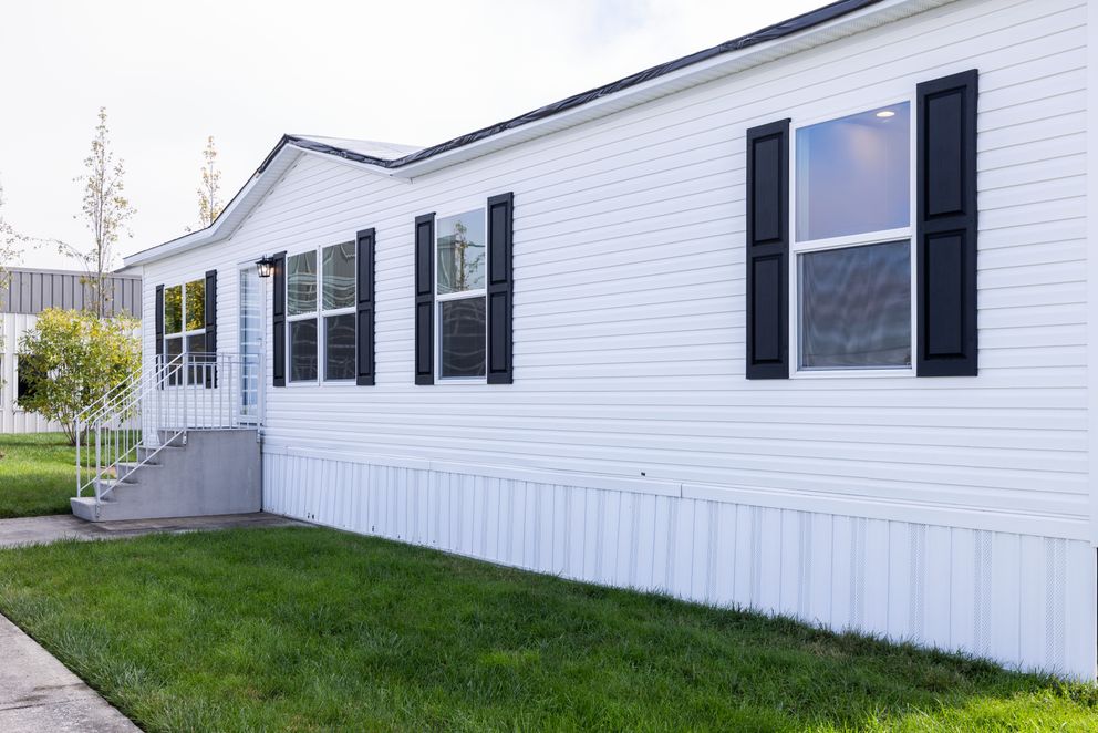 The PLATINUM ANNIVERSARY Exterior. This Manufactured Mobile Home features 3 bedrooms and 2 baths.
