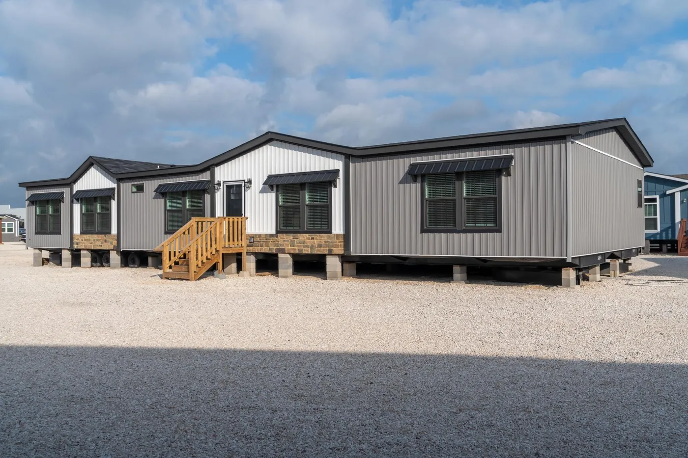 The THE MAGNOLIA Exterior. This Manufactured Mobile Home features 4 bedrooms and 3 baths.