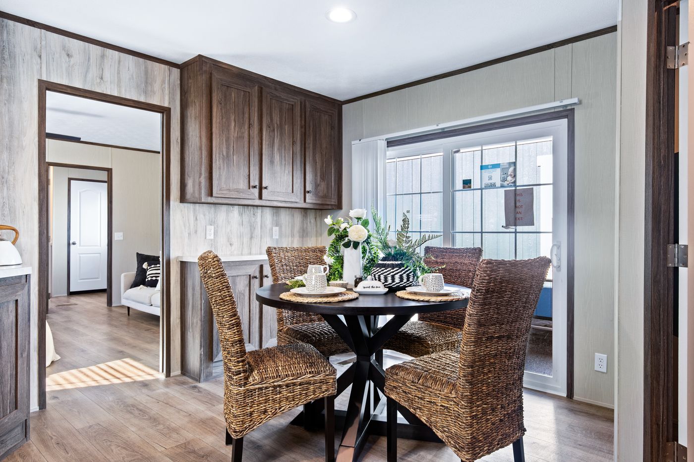 The ANNIVERSARY 16763F Dining Area. This Manufactured Mobile Home features 3 bedrooms and 2 baths.