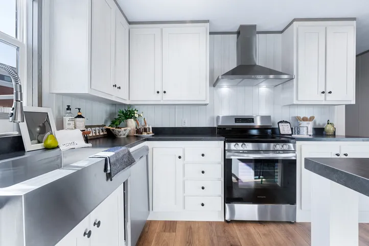 The ANNIVERSARY 16763I Kitchen. This Manufactured Mobile Home features 3 bedrooms and 2 baths.