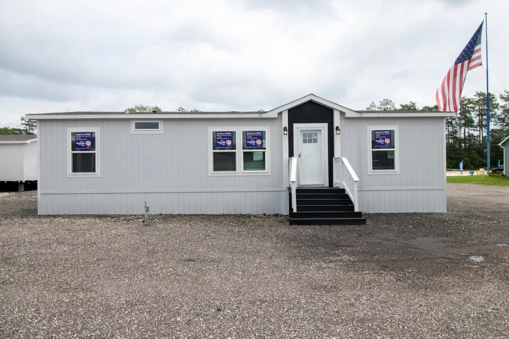 The THE REAL DEAL Exterior. This Manufactured Mobile Home features 3 bedrooms and 2 baths.