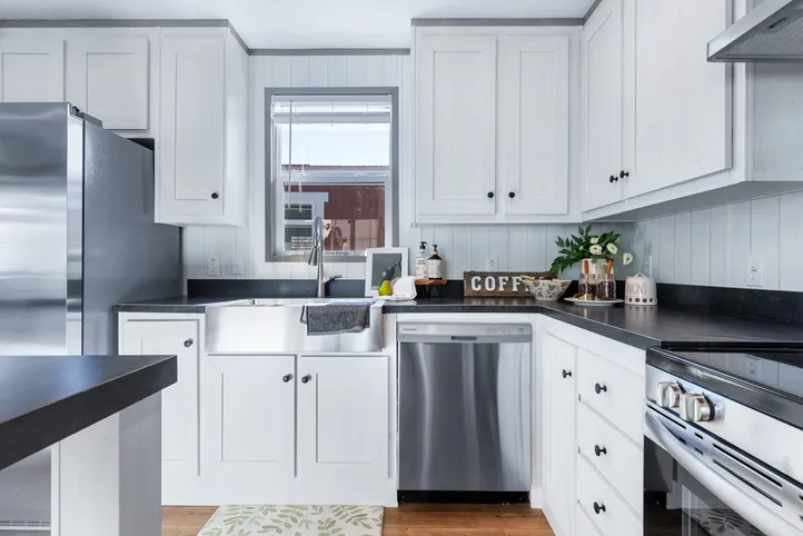 The ANNIVERSARY 16763I Kitchen. This Manufactured Mobile Home features 3 bedrooms and 2 baths.