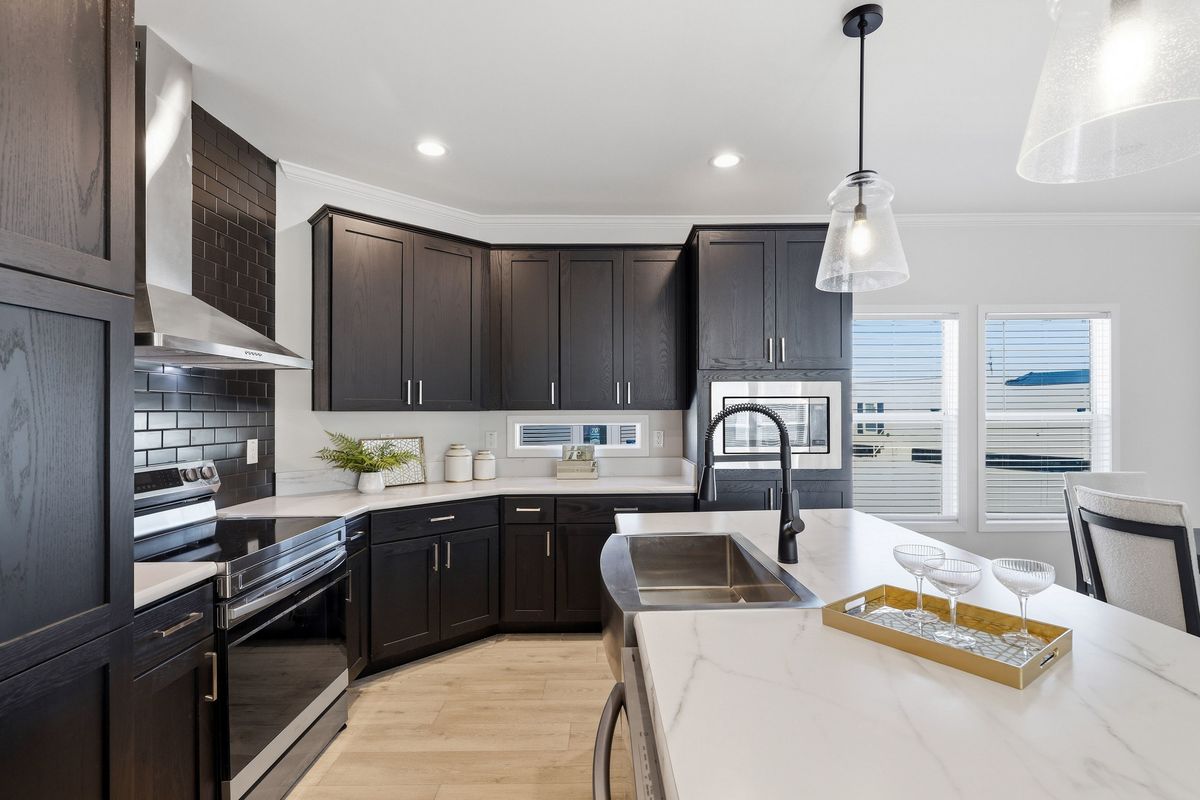The THE FREEDOM GRAND 4BR 32X62 Exterior. This Manufactured Mobile Home features 4 bedrooms and 2 baths.