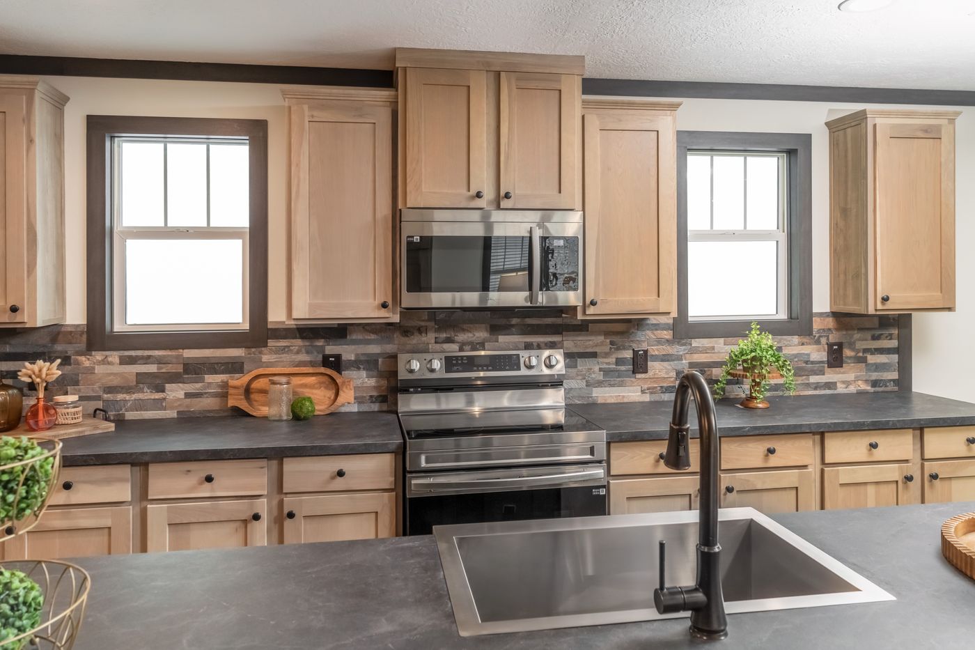 The BOUJEE LUX Exterior. This Manufactured Mobile Home features 4 bedrooms and 3 baths.