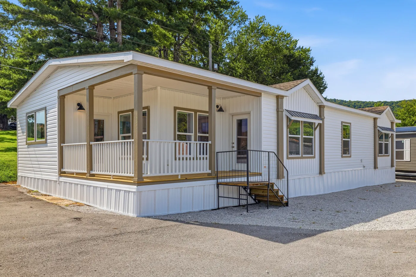 The SOUTHERN CHARM Exterior. This Manufactured Mobile Home features 3 bedrooms and 2 baths.