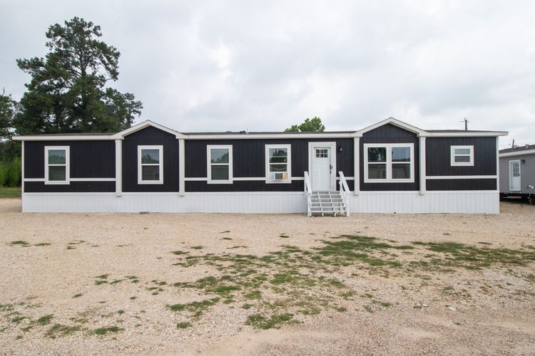 The BREEZE FARMHOUSE 72 Exterior. This Manufactured Mobile Home features 4 bedrooms and 2 baths.