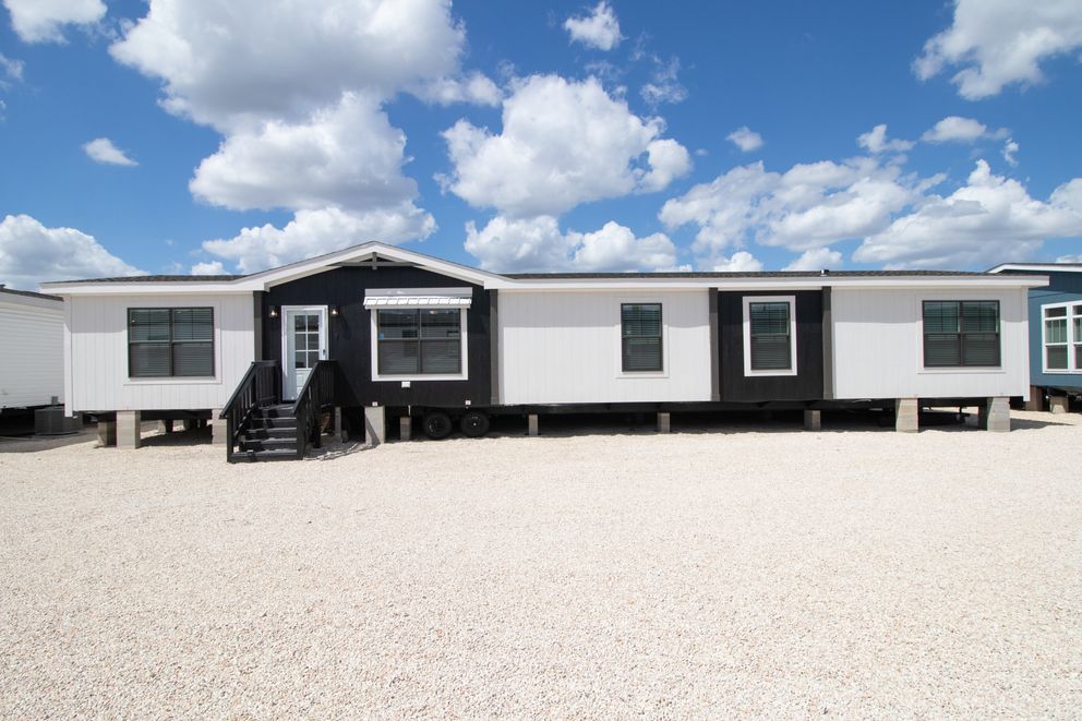 The FARM 4 FLEX Exterior. This Manufactured Mobile Home features 4 bedrooms and 3 baths.