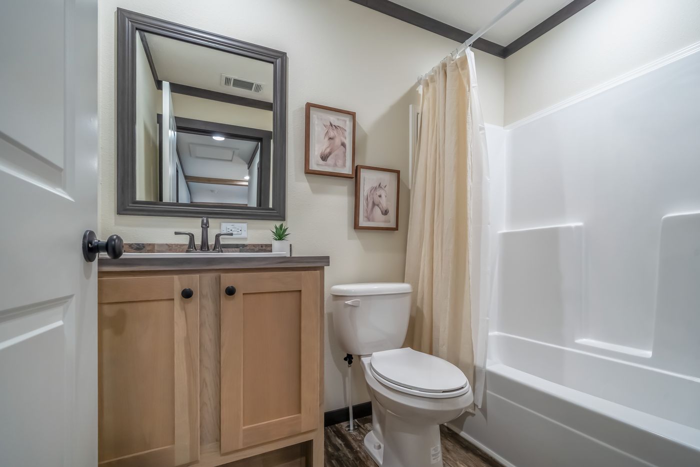 The BOUJEE LUX Exterior. This Manufactured Mobile Home features 4 bedrooms and 3 baths.