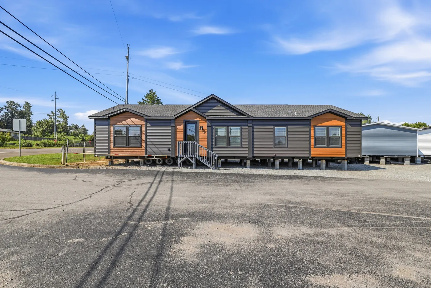 The SUPER 68 ELITE Exterior. This Manufactured Mobile Home features 3 bedrooms and 2 baths.