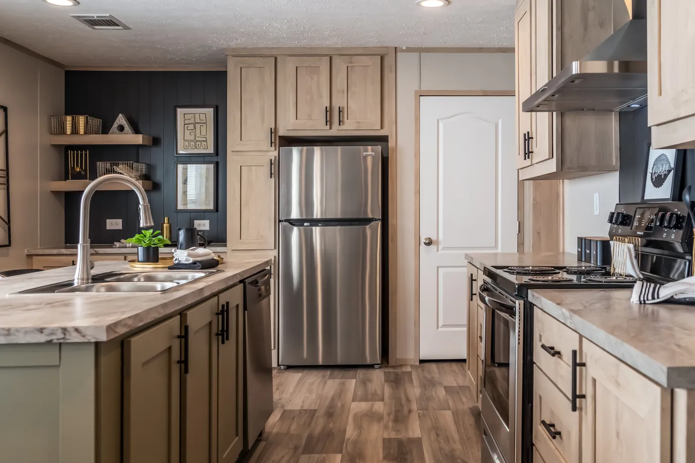 The RAINIER Exterior. This Manufactured Mobile Home features 4 bedrooms and 3 baths.