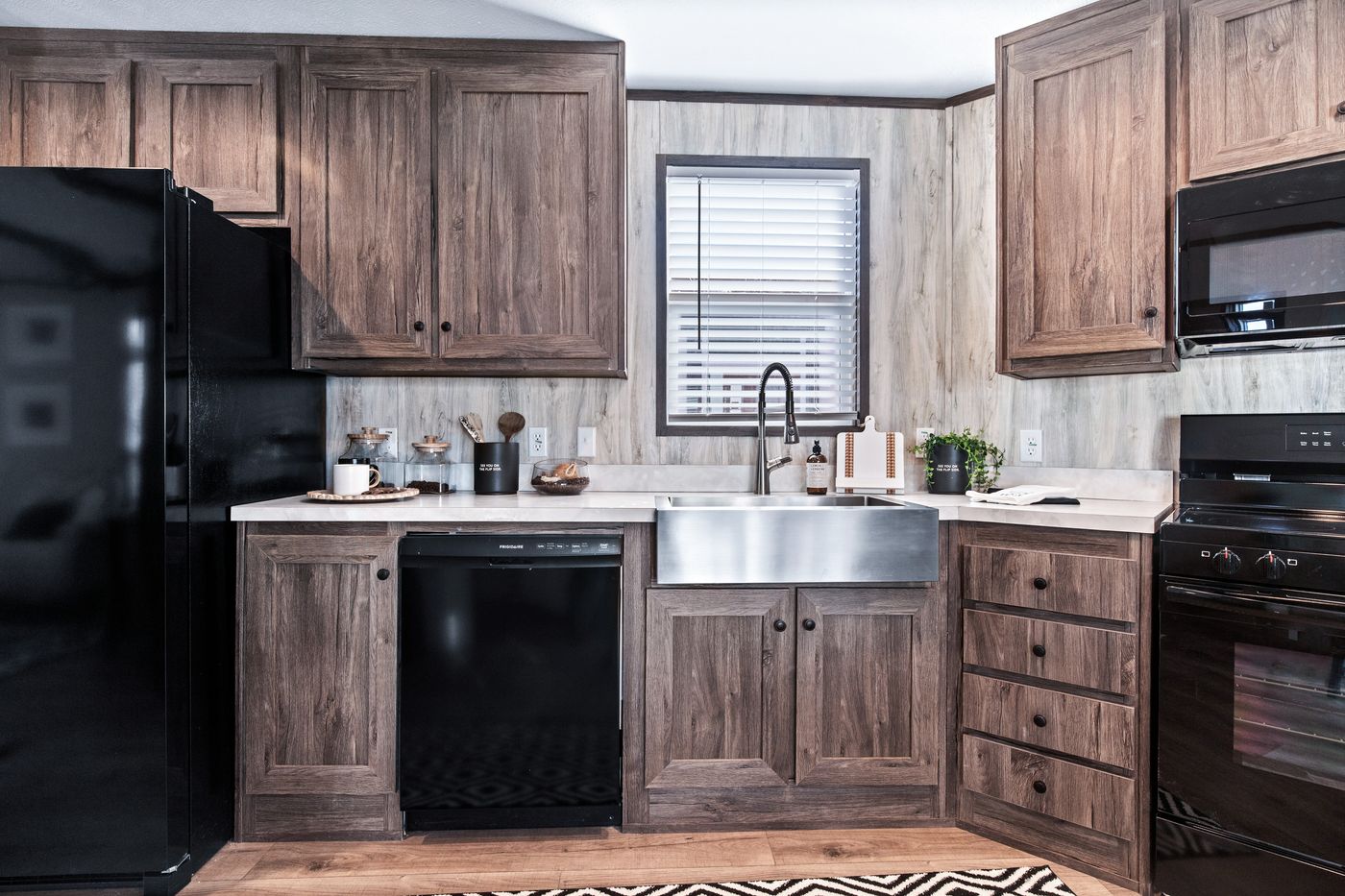 The ANNIVERSARY 16763F Kitchen. This Manufactured Mobile Home features 3 bedrooms and 2 baths.