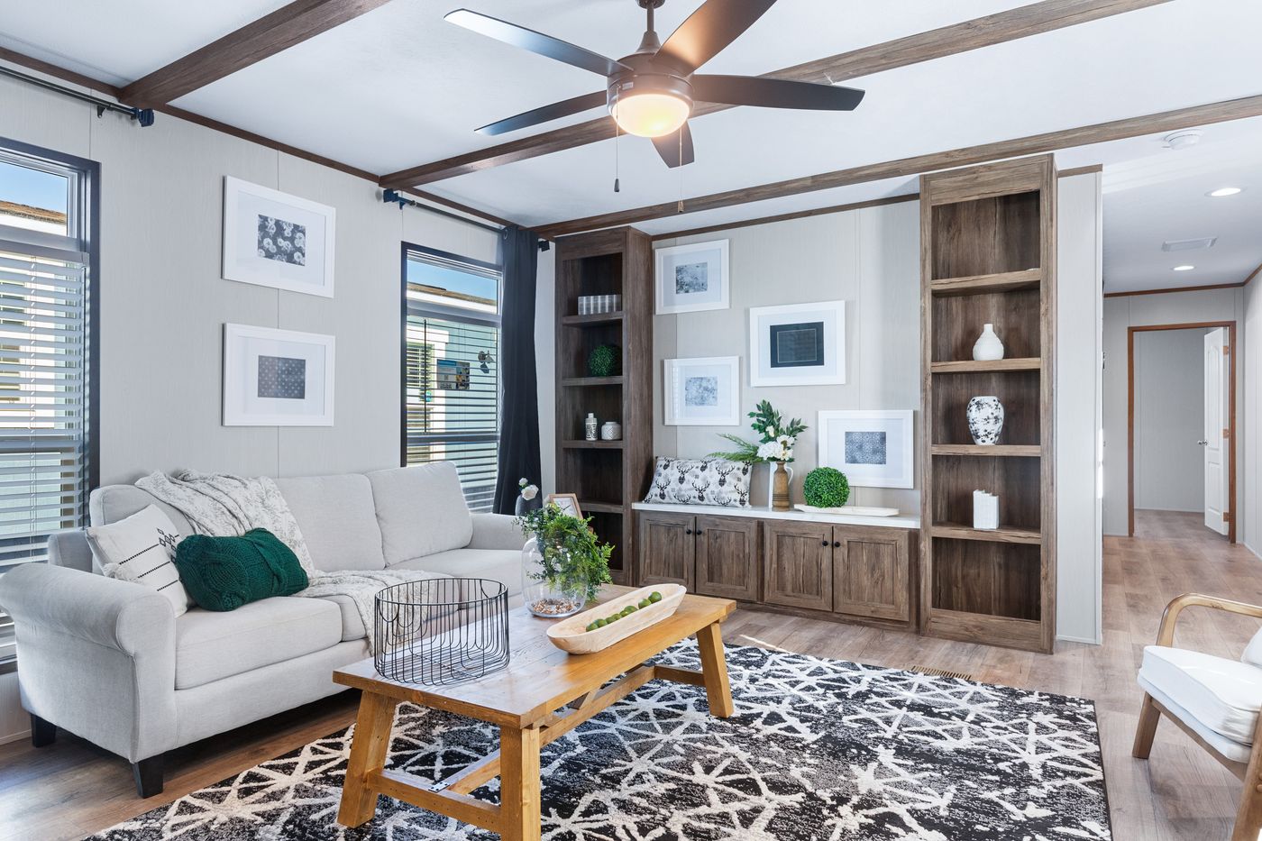 The ANNIVERSARY 16763F Living Room. This Manufactured Mobile Home features 3 bedrooms and 2 baths.