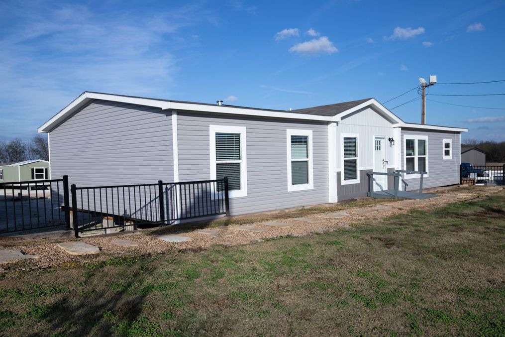 The BREEZE FARMHOUSE Exterior. This Manufactured Mobile Home features 3 bedrooms and 2 baths.