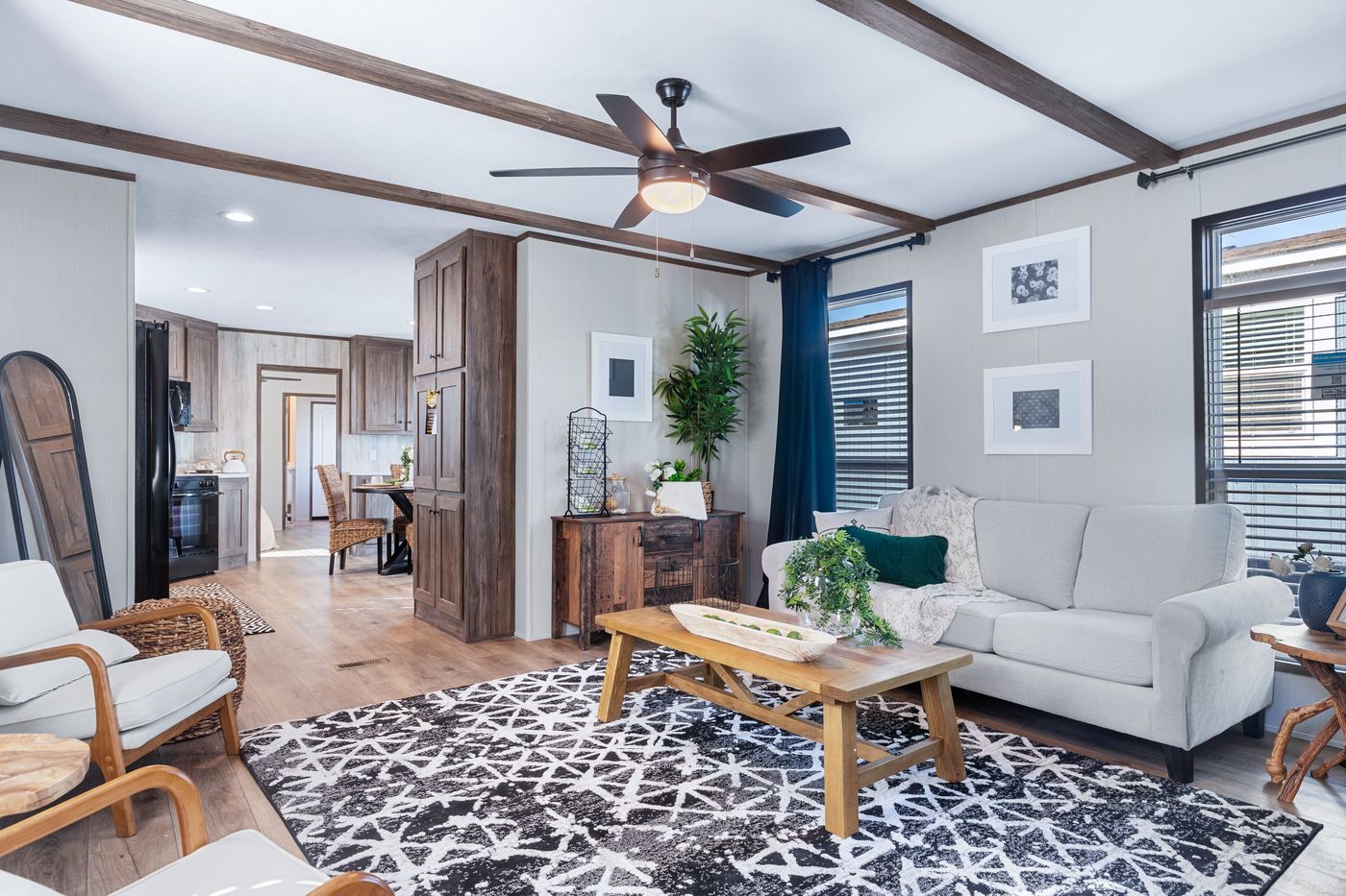 The ANNIVERSARY 16763F Living Room. This Manufactured Mobile Home features 3 bedrooms and 2 baths.