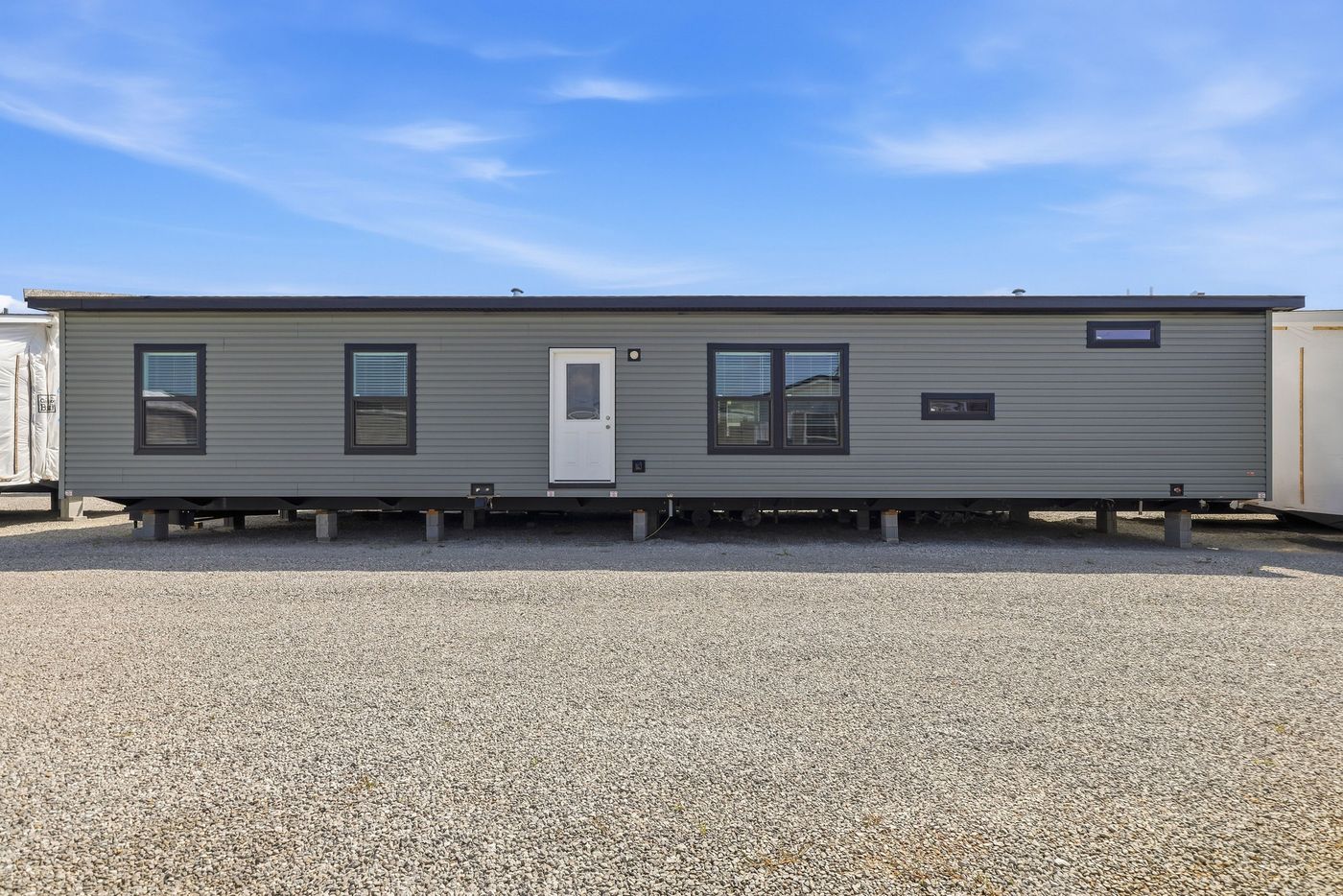 The THE FREEDOM GRAND 4BR 32X62 Exterior. This Manufactured Mobile Home features 4 bedrooms and 2 baths.