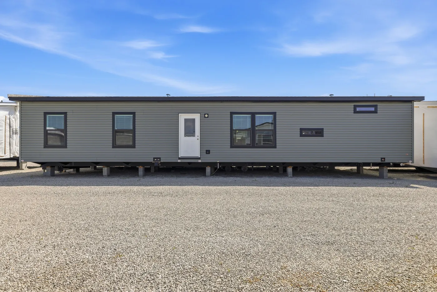 The THE FREEDOM GRAND 4BR 32X62 Exterior. This Manufactured Mobile Home features 4 bedrooms and 2 baths.