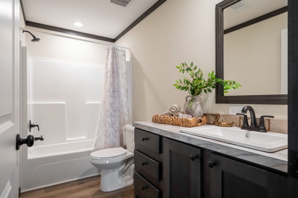 The THE VOGUE 60 Exterior. This Manufactured Mobile Home features 3 bedrooms and 2 baths.