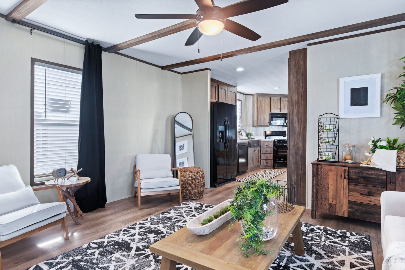 The ANNIVERSARY 16763F Living Room. This Manufactured Mobile Home features 3 bedrooms and 2 baths.
