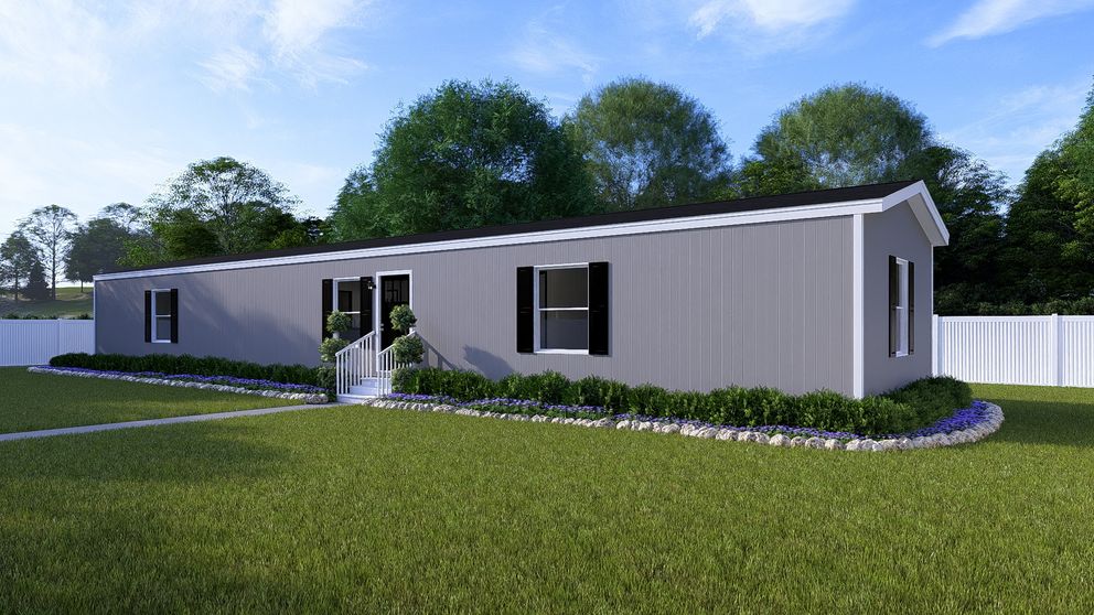 The COLOSSAL Exterior in Flint. This Manufactured Mobile Home features 3 bedrooms and 2 baths.