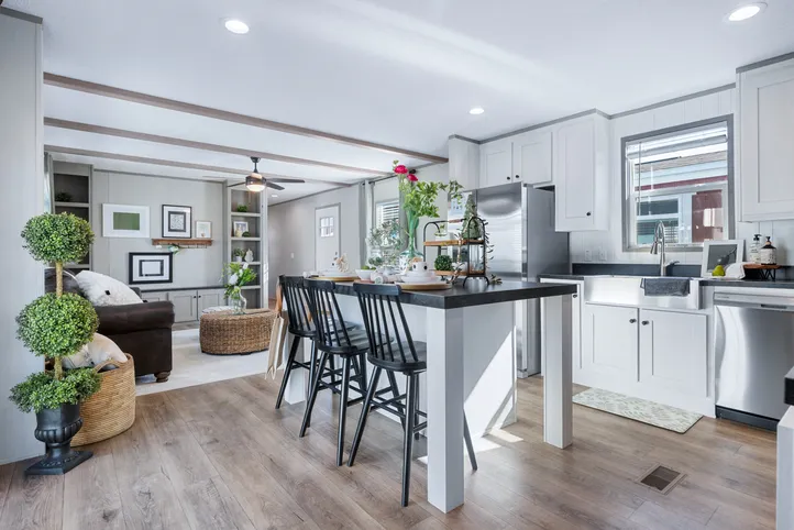 The ANNIVERSARY 16763I Dining Room. This Manufactured Mobile Home features 3 bedrooms and 2 baths.