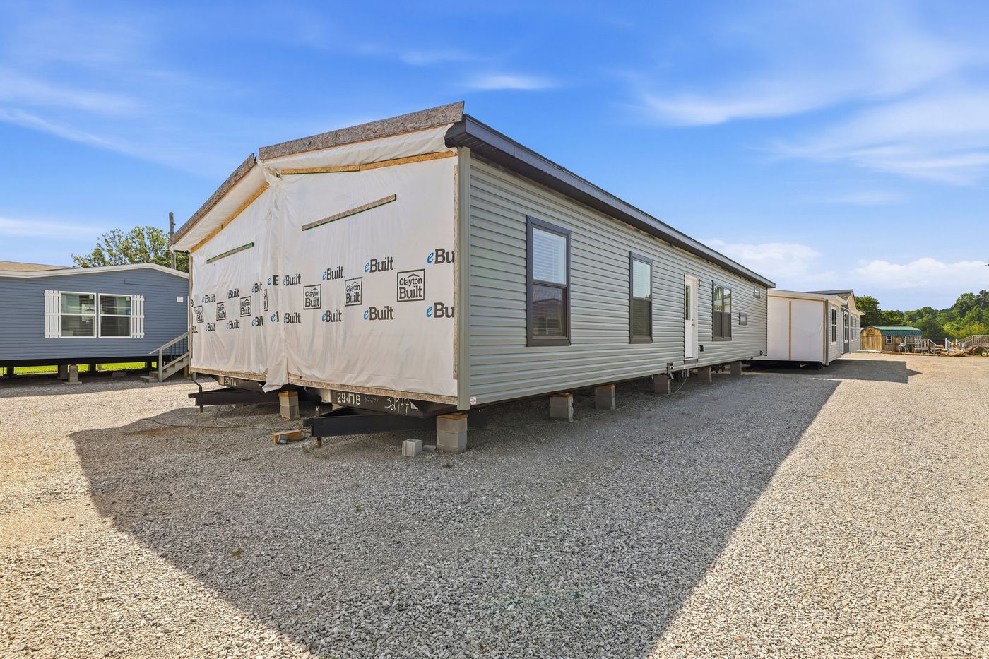 The THE FREEDOM GRAND 4BR 32X62 Exterior. This Manufactured Mobile Home features 4 bedrooms and 2 baths.