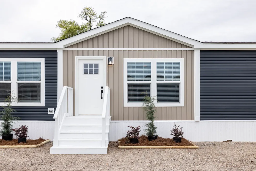 The SHOUT Exterior. This Manufactured Mobile Home features 3 bedrooms and 2 baths.