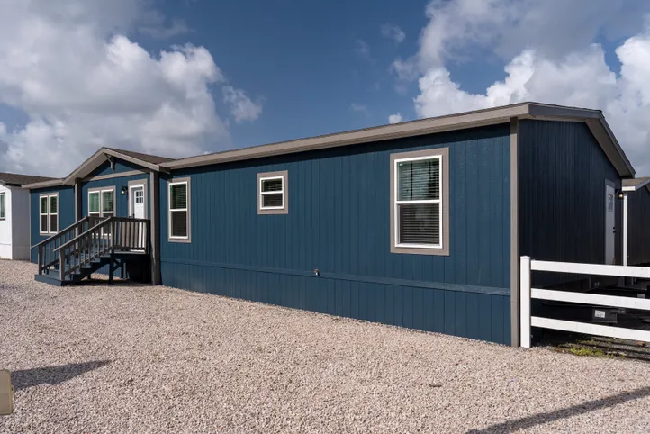 The EL SUENO BREEZE Exterior. This Manufactured Mobile Home features 4 bedrooms and 2 baths.