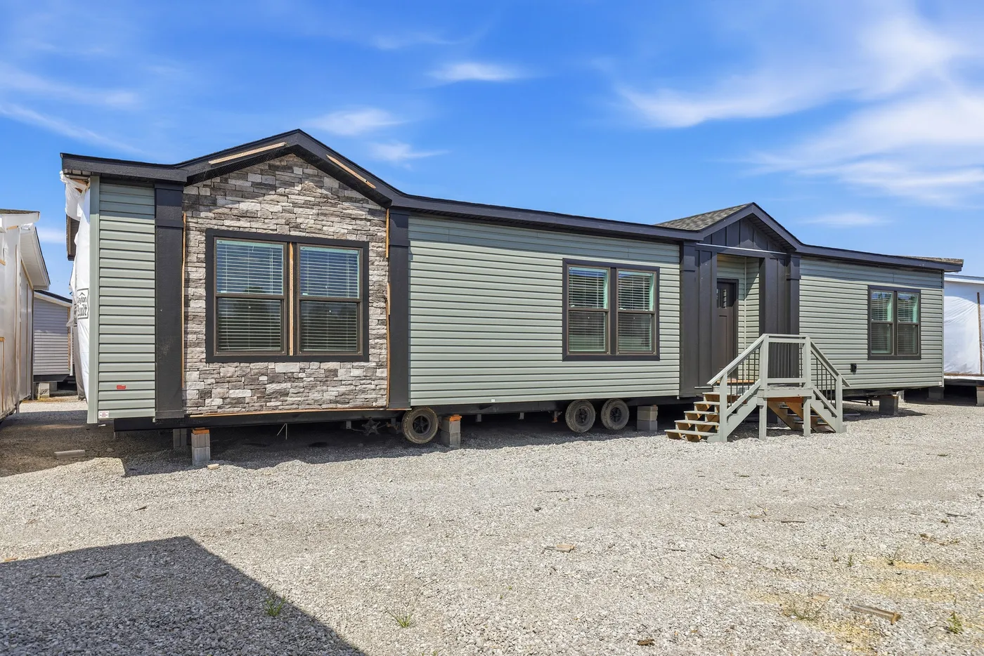 The THE FREEDOM GRAND 4BR 32X62 Exterior. This Manufactured Mobile Home features 4 bedrooms and 2 baths.