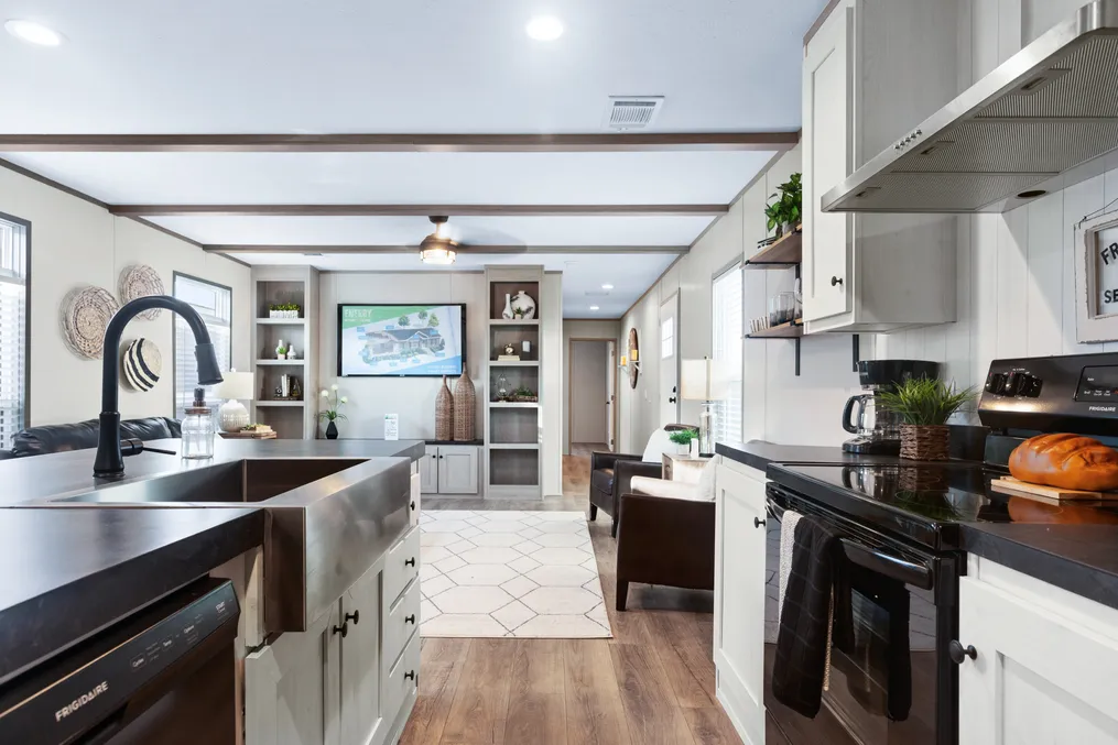 The ANNIVERSARY 16763S Kitchen. This Manufactured Mobile Home features 3 bedrooms and 2 baths.