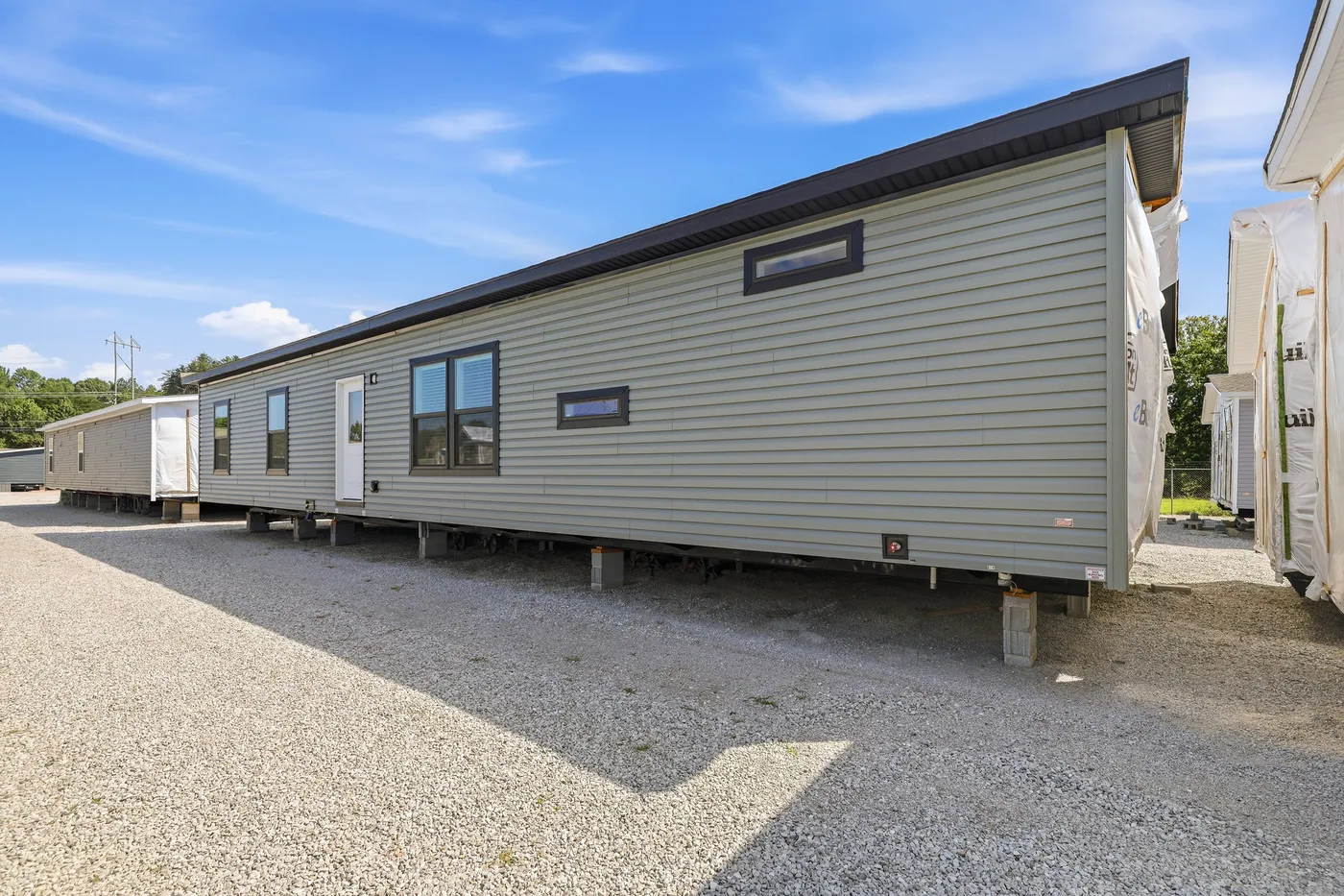 The THE FREEDOM GRAND 4BR 32X62 Exterior. This Manufactured Mobile Home features 4 bedrooms and 2 baths.