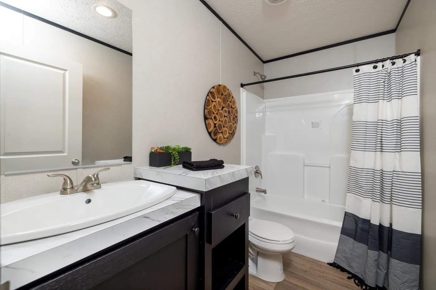 The PLATINUM ANNIVERSARY Exterior. This Manufactured Mobile Home features 3 bedrooms and 2 baths.