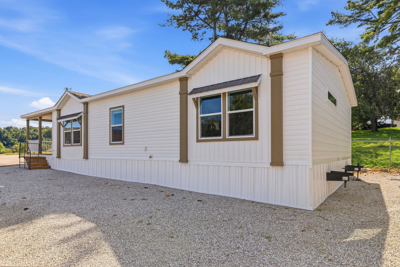 The SOUTHERN CHARM Exterior. This Manufactured Mobile Home features 3 bedrooms and 2 baths.