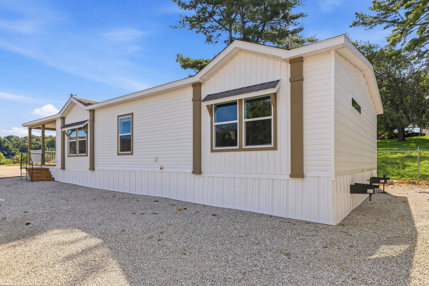 The SOUTHERN CHARM Exterior. This Manufactured Mobile Home features 3 bedrooms and 2 baths.
