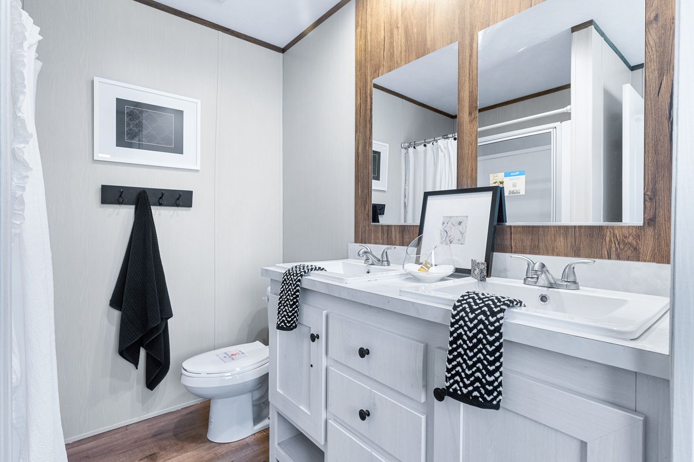 The ANNIVERSARY 16763F Primary Bathroom. This Manufactured Mobile Home features 3 bedrooms and 2 baths.
