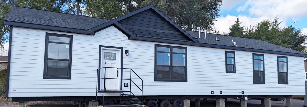 The 50TH ANNIVERSARY Exterior. This Manufactured Mobile Home features 3 bedrooms and 2 baths.