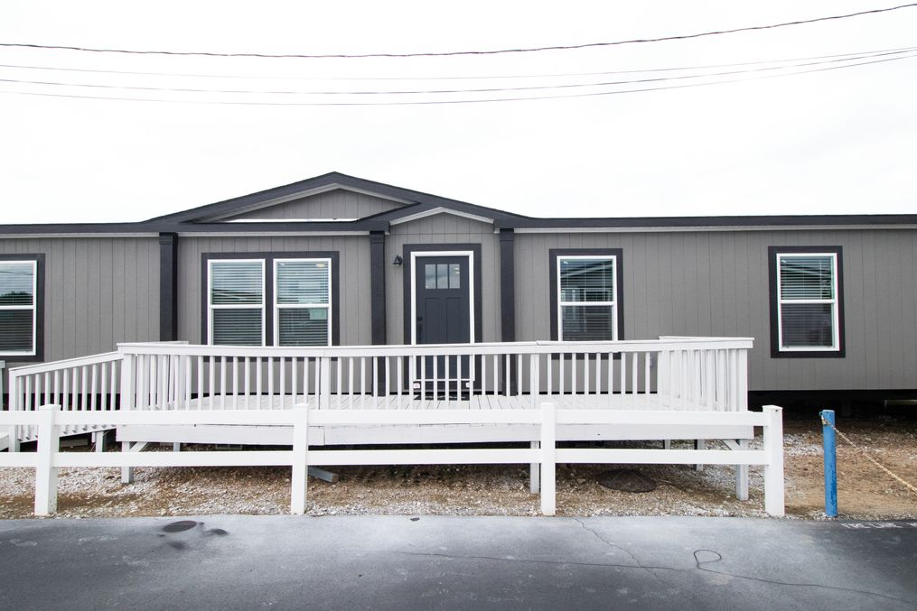 The ABSOLUTE VALUE Exterior. This Manufactured Mobile Home features 4 bedrooms and 2 baths.