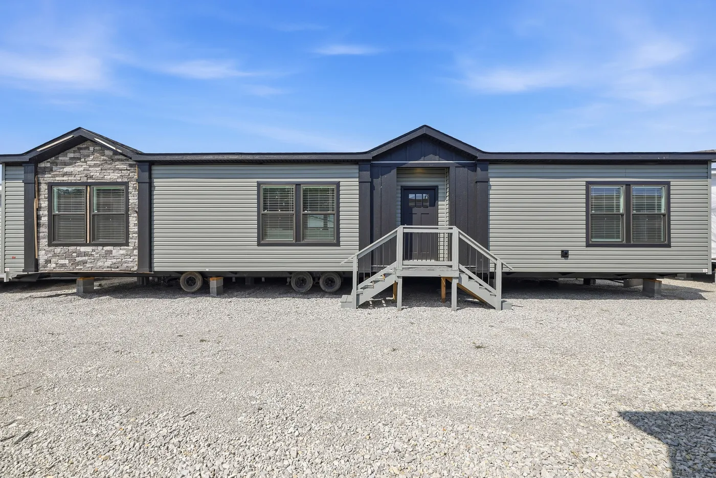 The THE FREEDOM GRAND 4BR 32X62 Exterior. This Manufactured Mobile Home features 4 bedrooms and 2 baths.