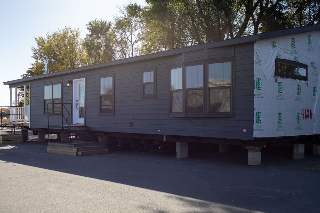 The LEGEND 76-4 Exterior. This Manufactured Mobile Home features 3 bedrooms and 2 baths.