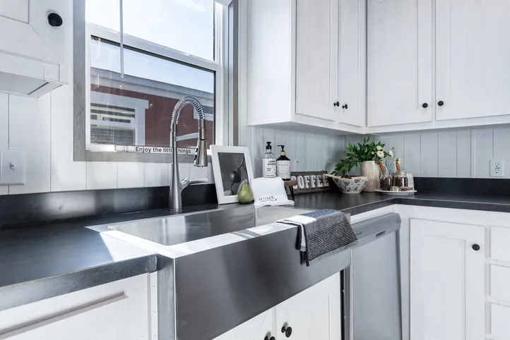 The ANNIVERSARY 16763I Kitchen. This Manufactured Mobile Home features 3 bedrooms and 2 baths.