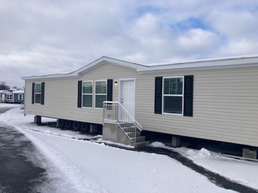 The AURORA PLACE 5228-MS049-1 SECT Exterior. This Manufactured Mobile Home features 3 bedrooms and 2 baths.