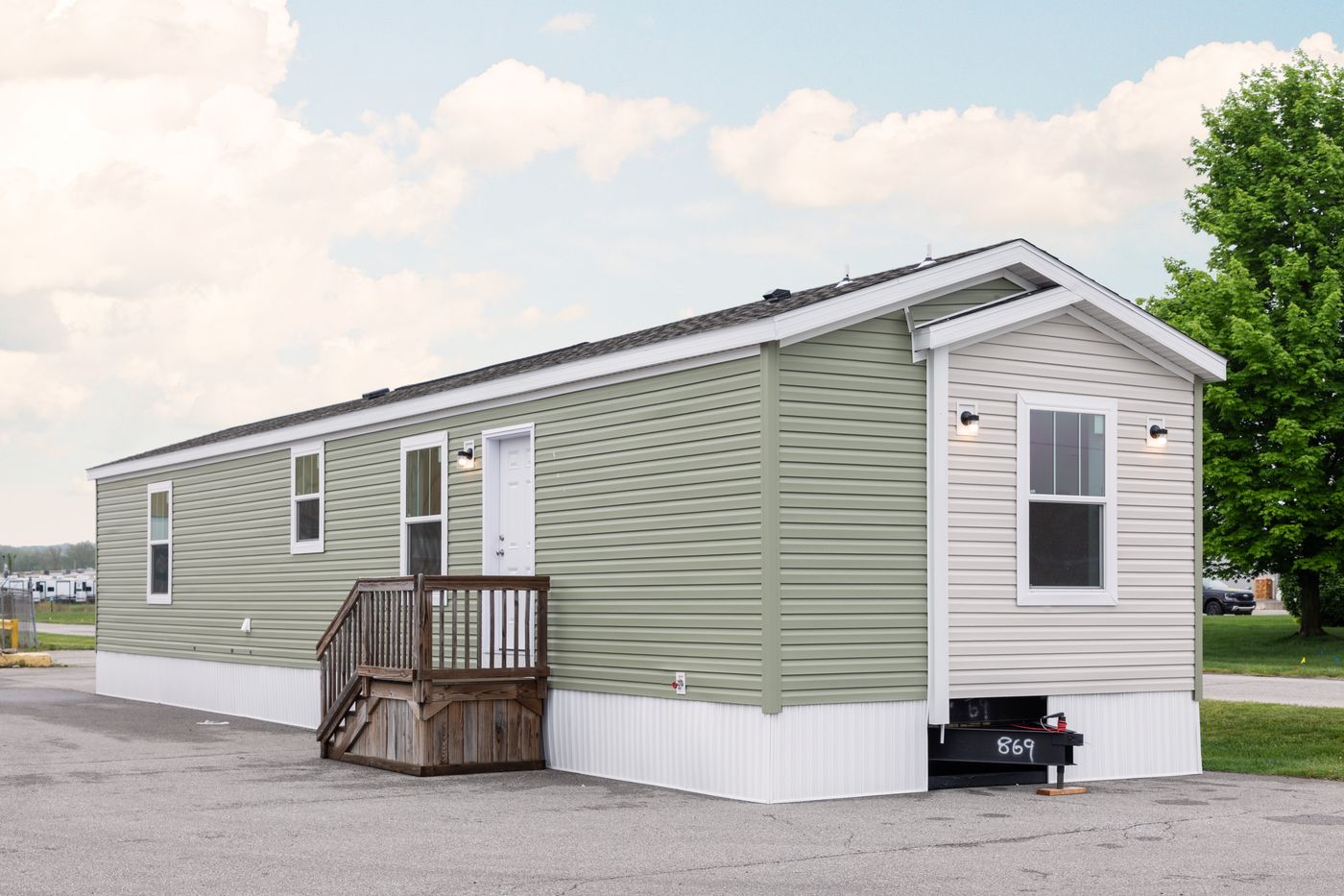 The 6016-SW019 SUNRISE SW Exterior. This Manufactured Mobile Home features 2 bedrooms and 2 baths.