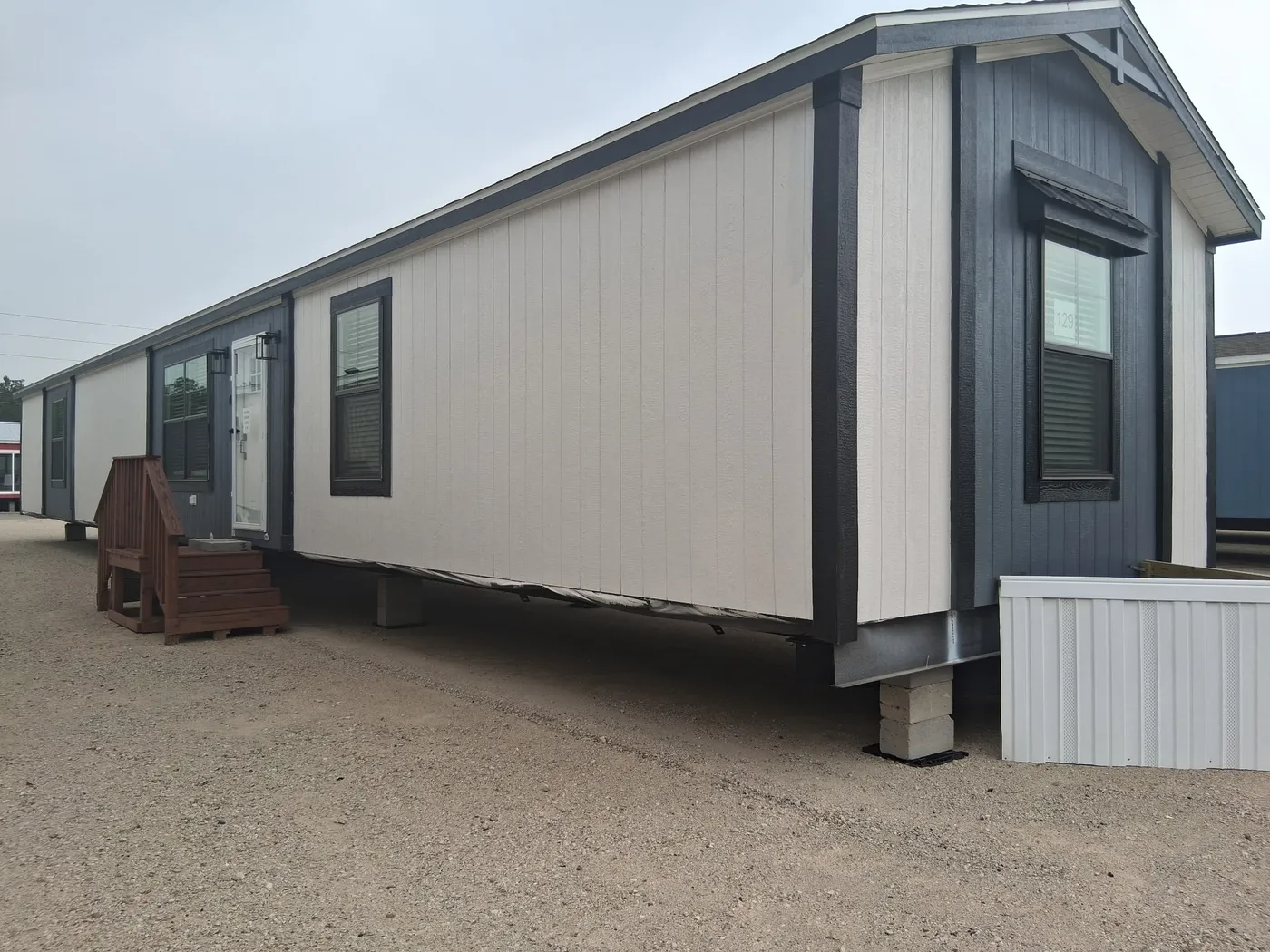 The LEXI Exterior. This Manufactured Mobile Home features 3 bedrooms and 2 baths.
