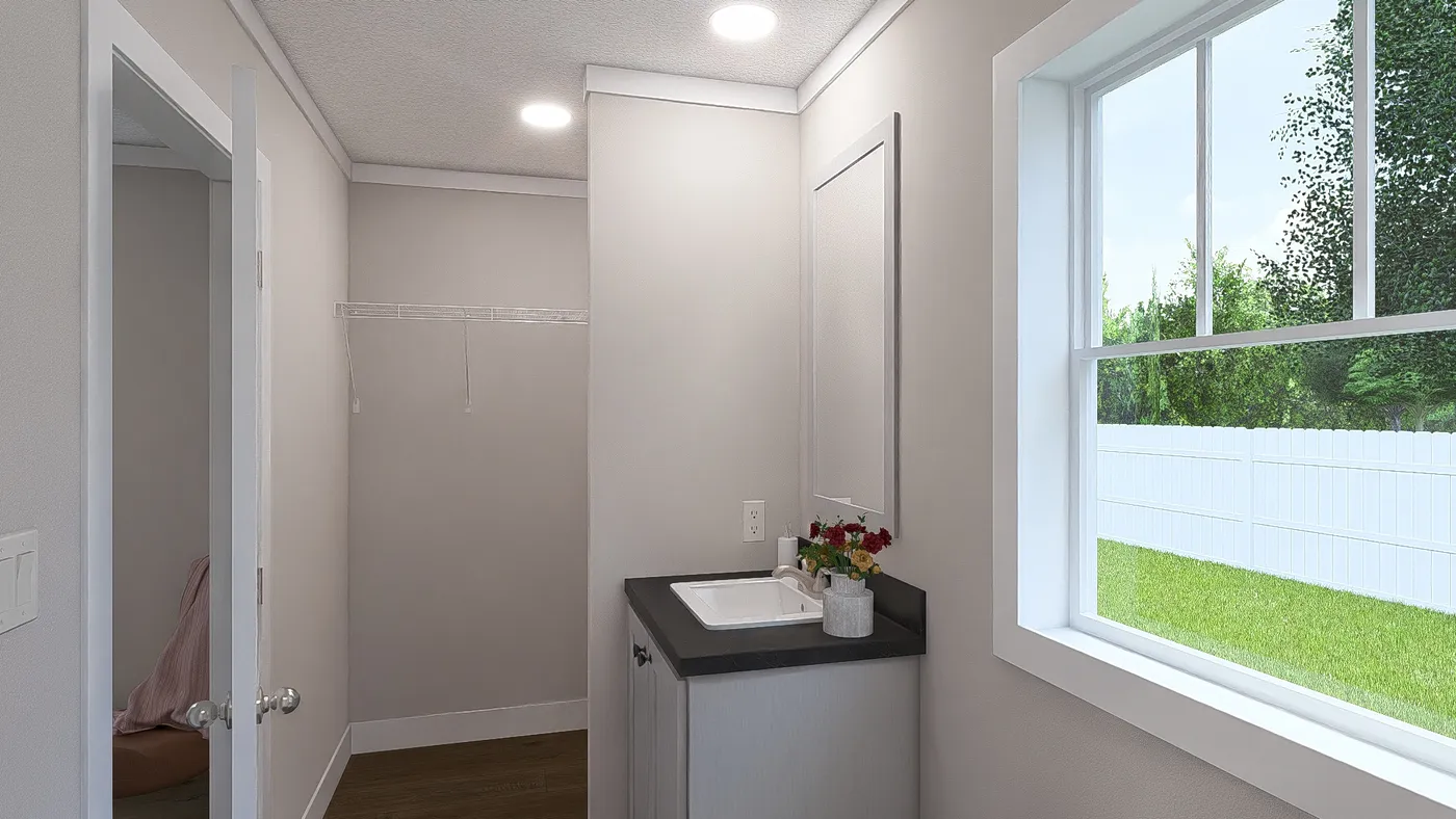 The MOVE ON UP Exterior. This Manufactured Mobile Home features 3 bedrooms and 2 baths.