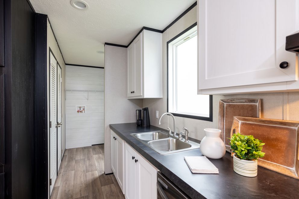 The PLATINUM ANNIVERSARY Exterior. This Manufactured Mobile Home features 3 bedrooms and 2 baths.