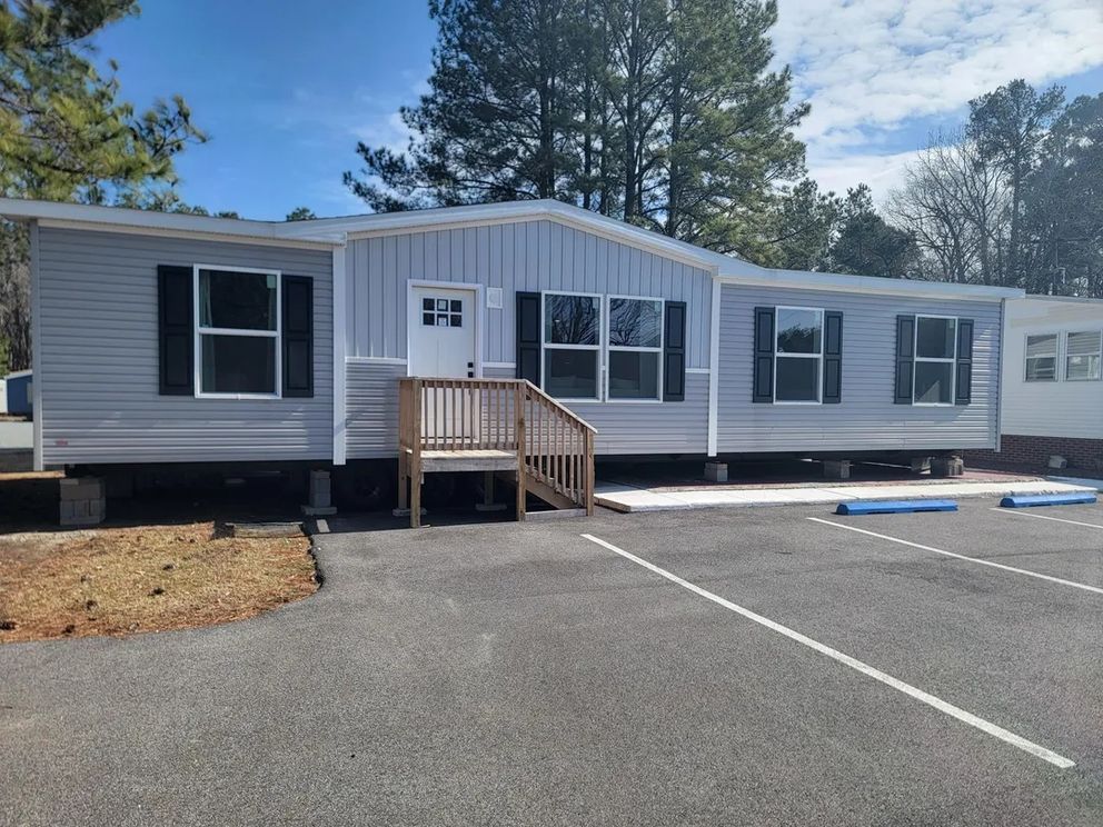 The AMETHYST 52 Exterior. This Manufactured Mobile Home features 3 bedrooms and 2 baths.
