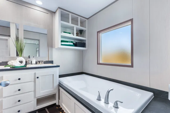 The ANNIVERSARY 16763I Guest Bathroom. This Manufactured Mobile Home features 3 bedrooms and 2 baths.