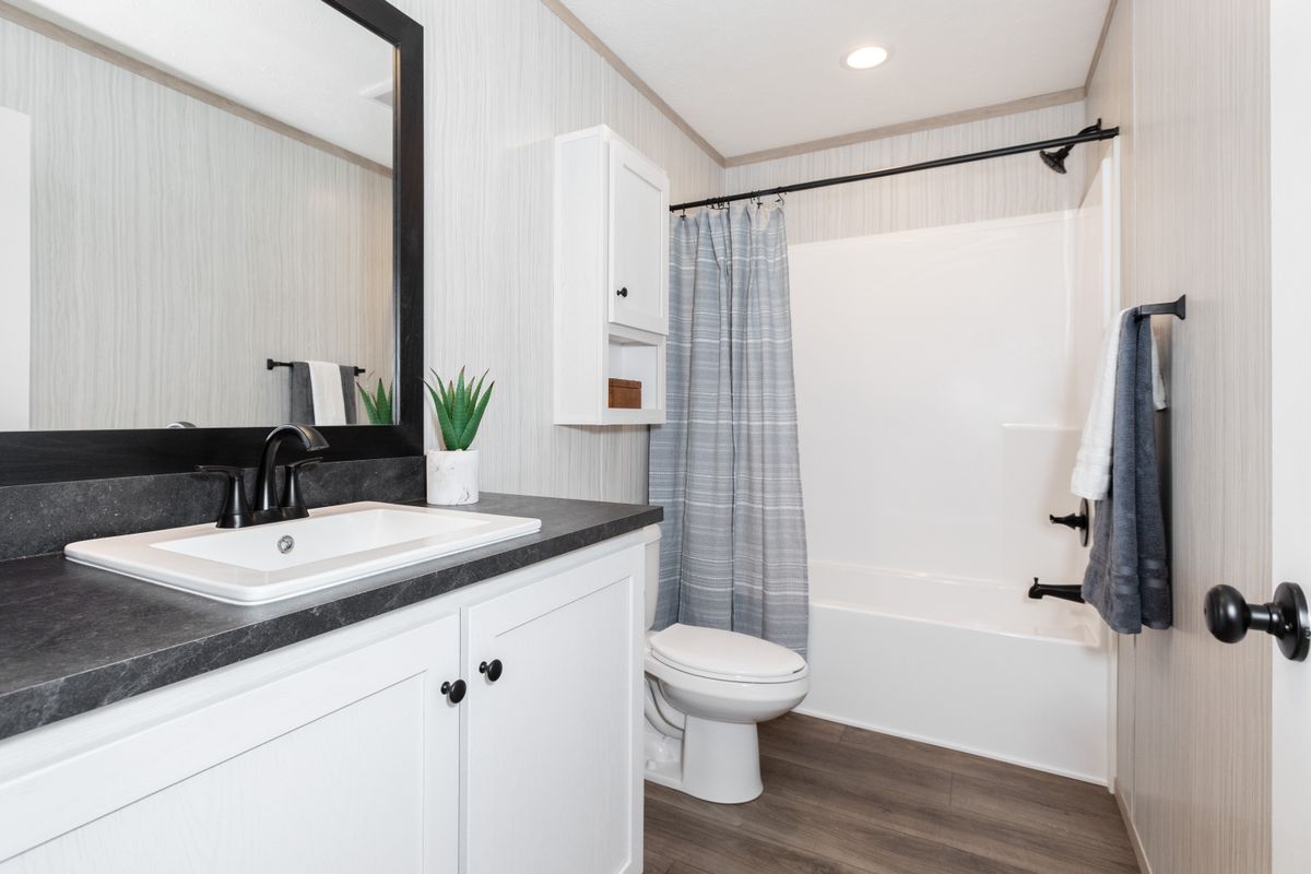 The 6032-5700 THE PULSE Exterior. This Manufactured Mobile Home features 3 bedrooms and 2 baths.
